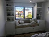 Custom daybed with side shelving units